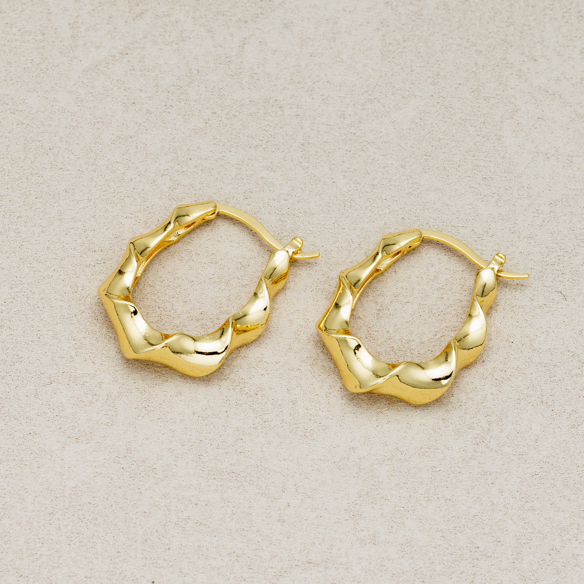 Launch Promo: 24K Gold PVD Stainless Steel Irregular Twisted Hoop Earring in Gold & Silver