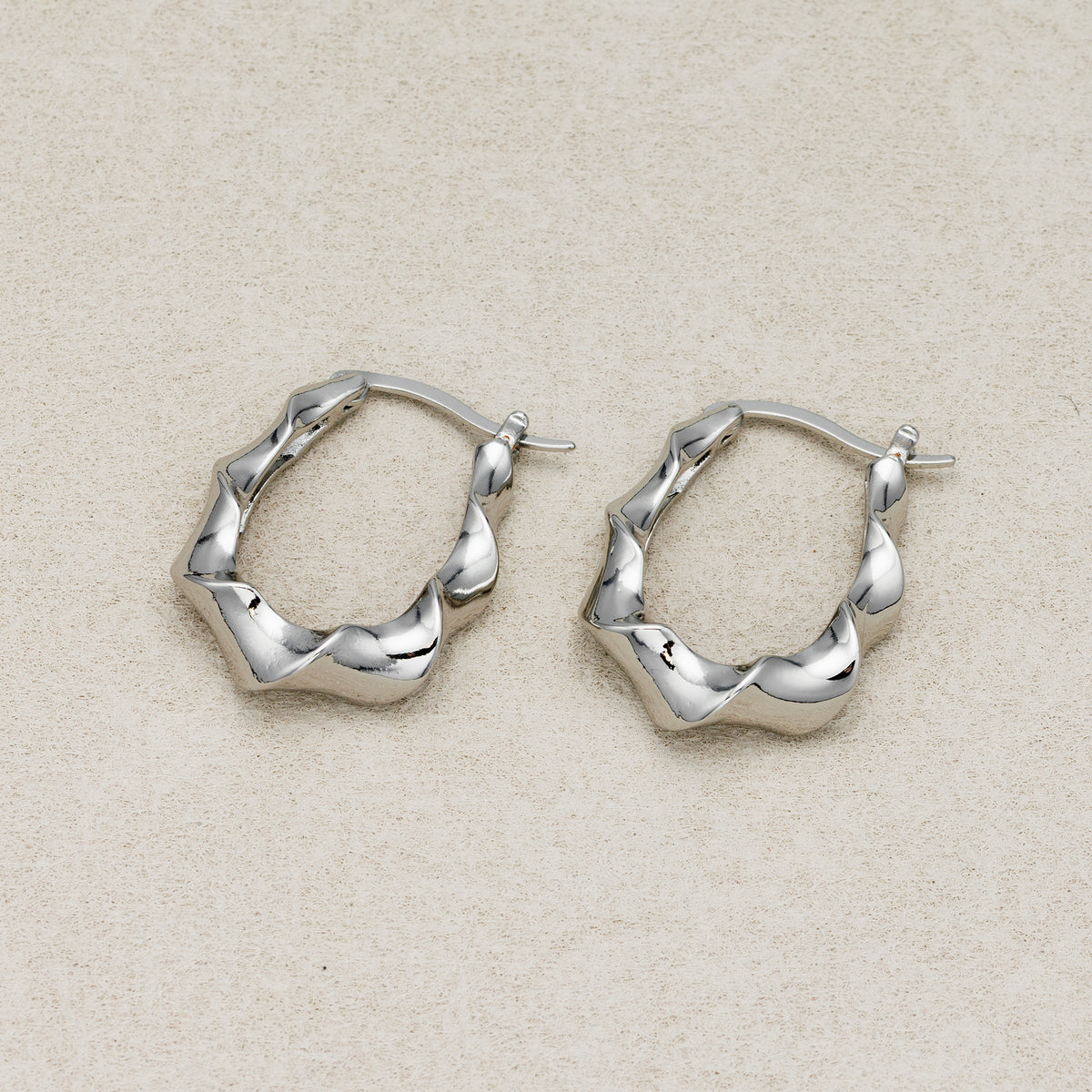 Launch Promo: 24K Gold PVD Stainless Steel Irregular Twisted Hoop Earring in Gold & Silver