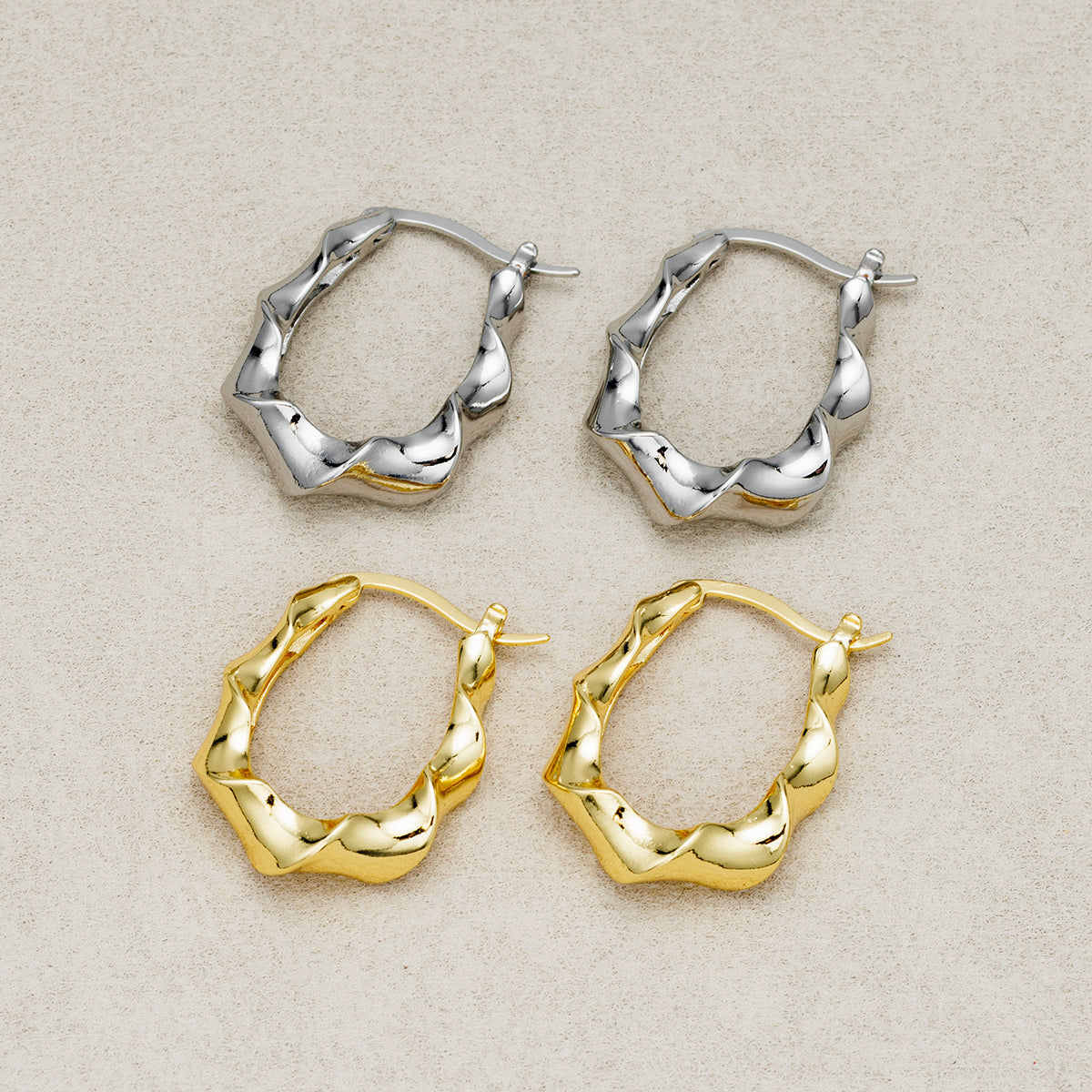 Launch Promo: 24K Gold PVD Stainless Steel Irregular Twisted Hoop Earring in Gold & Silver